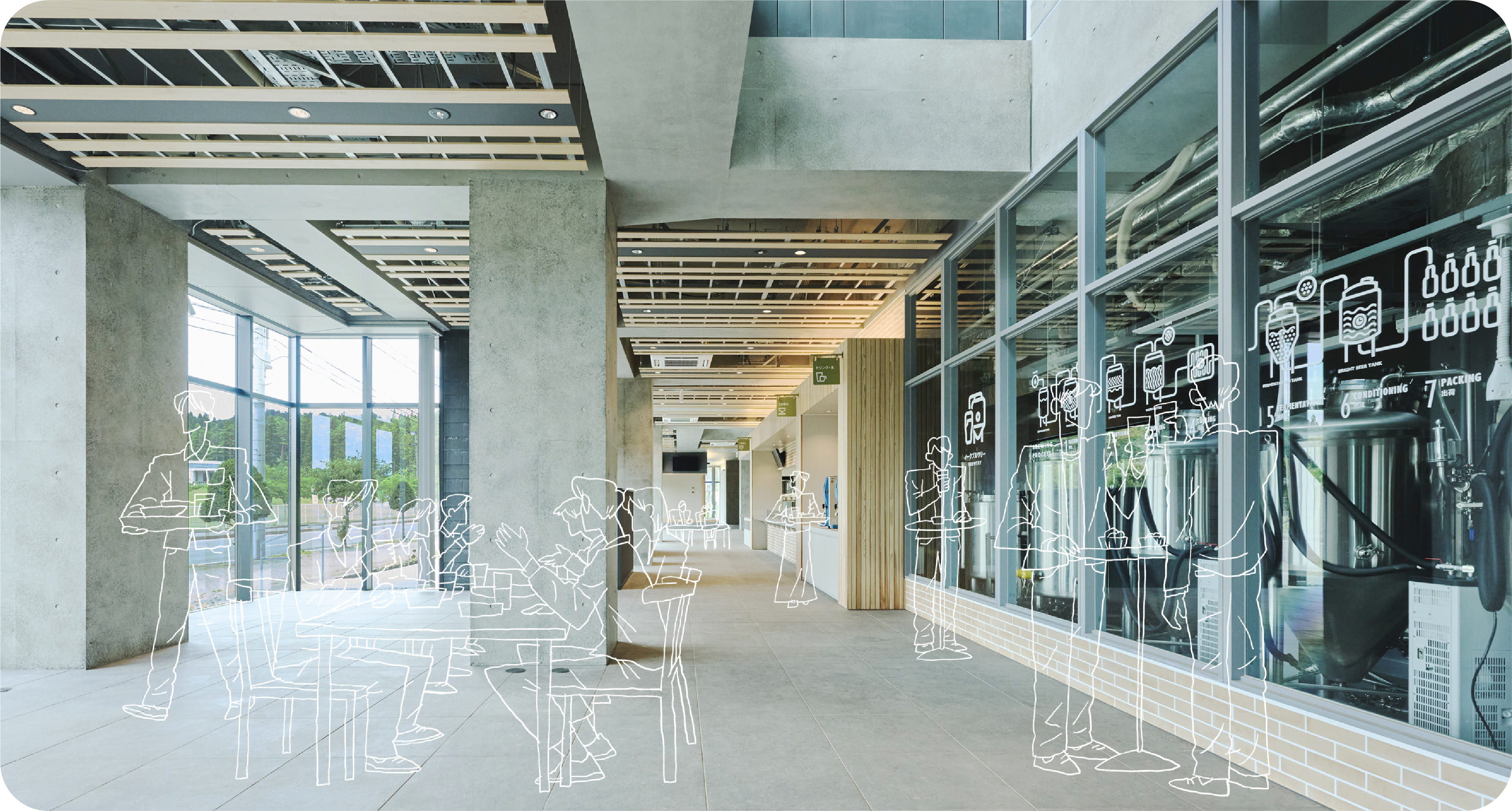 施設内部、明るいコミュニティスペースと大きな窓